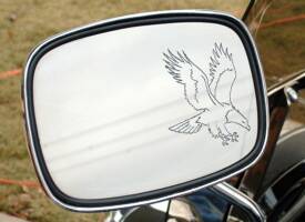 Motorcycle mirror engraved with eagle.
